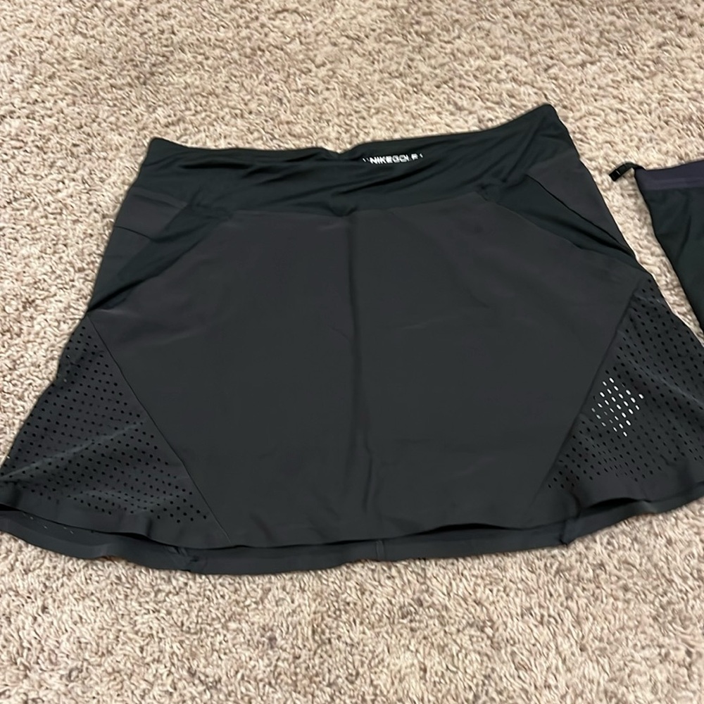Women's Nike Dri-fit golf skirts with detachable compression shorts.